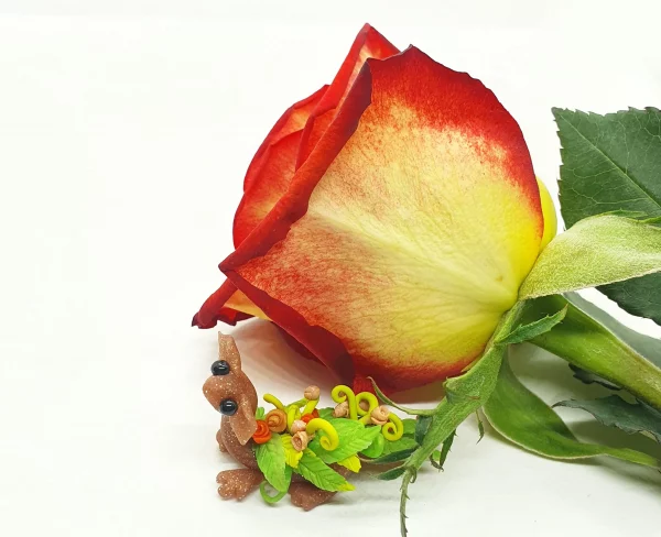 miniature dragon made from clay with flowers