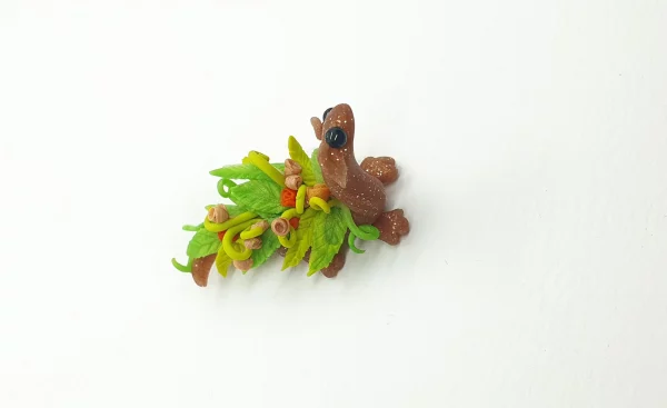 miniature dragon made from clay with flowers