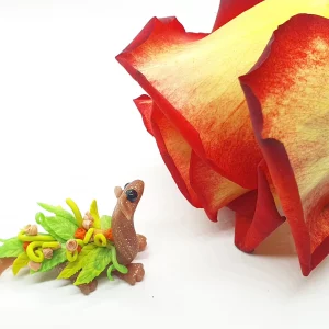 miniature dragon made from clay with flowers