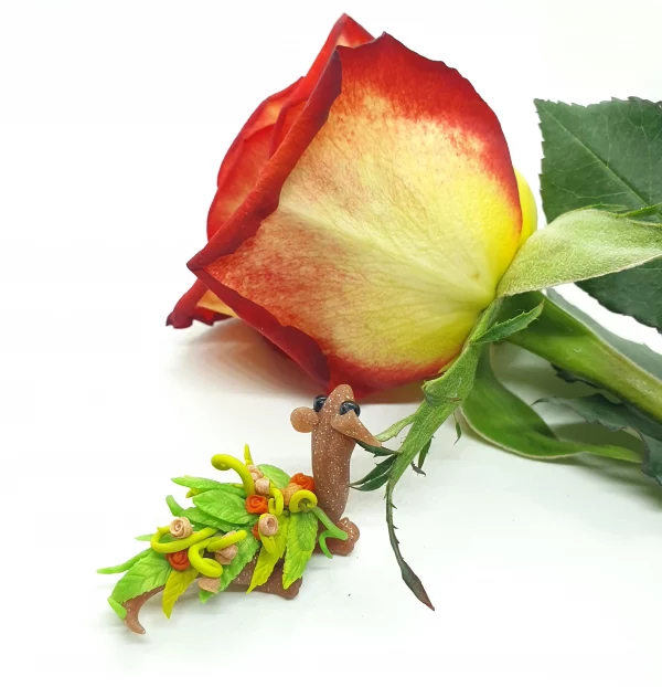 miniature dragon made from clay with flowers