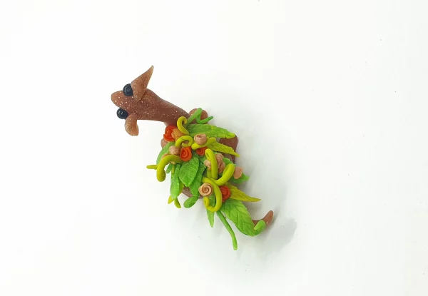 miniature dragon made from clay with flowers