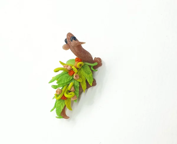 miniature dragon made from clay with flowers